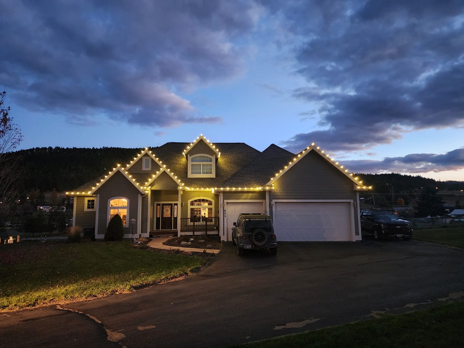 Brightwash warm white Christmas roofline installation at dusk